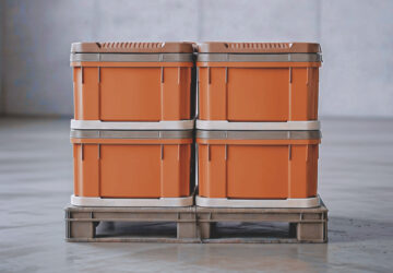Sealed plastic storage bins elevated on a pallet to help protect belongings from rodents