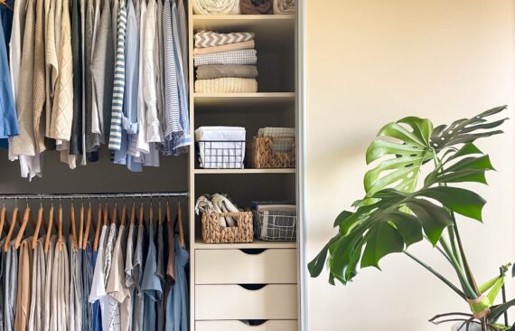 Small organized closet with double hanging rods, shelves and drawers